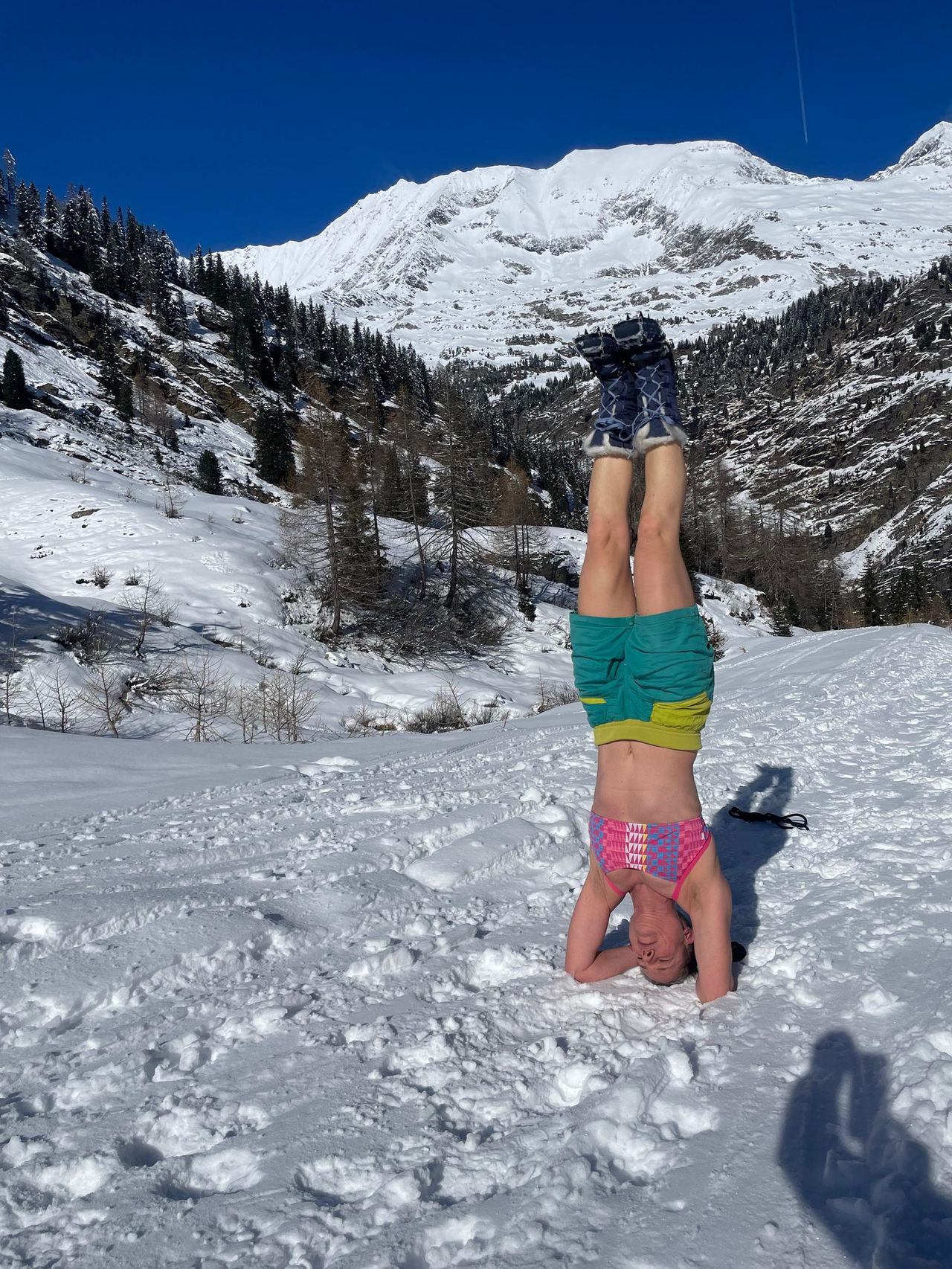 Wim Hof Method headstand in the snow